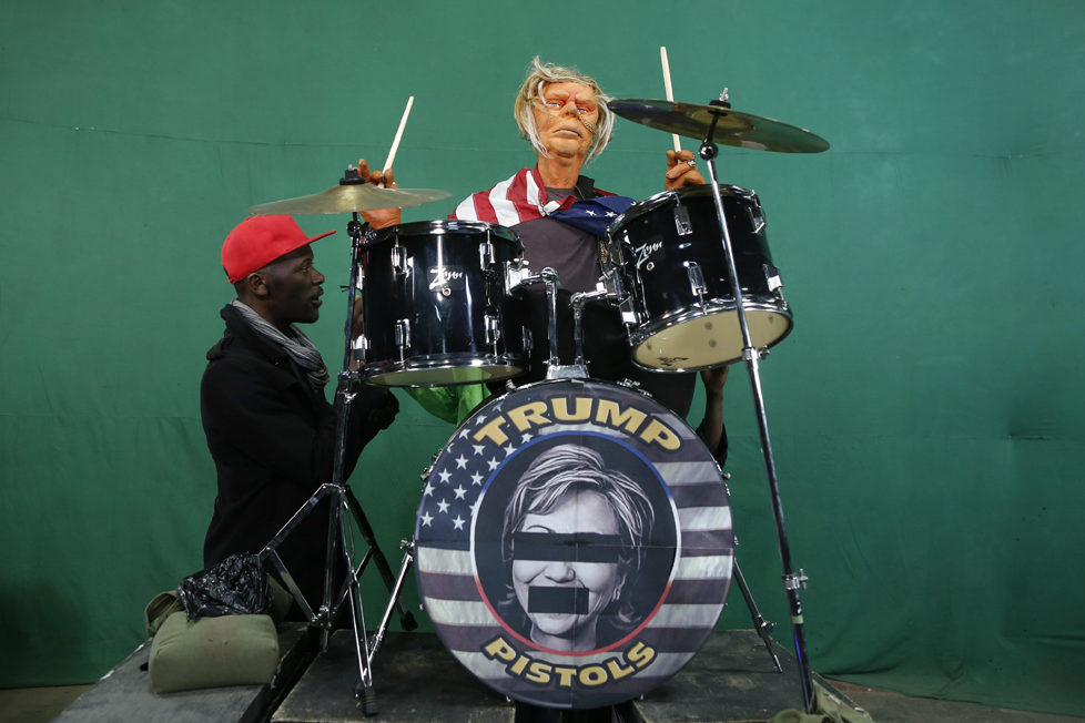 epa05548734 (16/19) Puppeteers control the Donald Trump puppet dressed as a punk rock star and singing the remix of 'God Save The Queen' by the Sex Pistols during the shooting of the 11th season of 'The XYZ Show' satirical puppet show at a studio in Nairobi, Kenya, 30 August 2016. The XYZ Show is Kenya‚Äôs popular satirical television program and has been taking pokes at the country‚Äôs political elites and international figures ever since it aired its first episode in 2009. With the 2016 US presidential elections, the show is now taking on Republican Presidential candidate Donald Trump. EPA/DAI KUROKAWA PLEASE REFER TO ADVISORY NOTICE (epa05548718) FOR FULL FEATURE TEXT