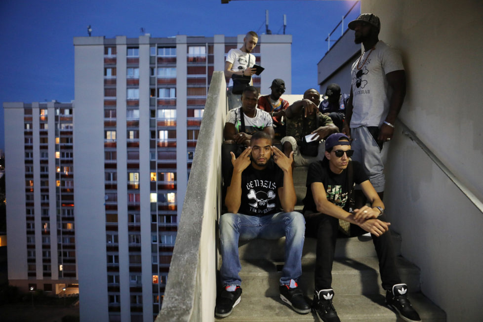 Rapper Worms-T poses for a picture with friends from the "La Rue La Vraie" (The Real Street) crew on a staircase in the Cite Raymond Queneau in Pantin, France, September 1, 2016. REUTERS/Joe Penney SEARCH "CREATIVE BANLIEUE" FOR THIS STORY. SEARCH "WIDER IMAGE" FOR ALL STORIES. TPX IMAGES OF THE DAY?THE IMAGES SHOULD ONLY BE USED TOGETHER WITH THE STORY - NO STAND-ALONE USES.