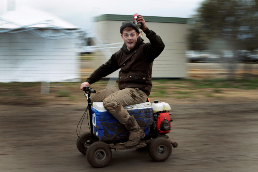Sheep shearer Chris Kermond from Ballarat in the Australian state of Victoria rides a motorised 'esky' or drink cooler, while drinking a can of pre-mixed rum and cola at the Deni Ute Muster in Deniliquin, New South Wales, September 29, 2016. REUTERS/Jason Reed SEARCH "UTE CULTURE" FOR THIS STORY. SEARCH "THE WIDER IMAGE" FOR ALL STORIES.