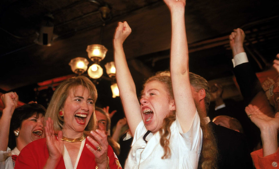 Hillary Rodham Clinton & daughter Chelsea cheering for presidential nominee husband/dad Bill Clinton, latter raising arms in excitement, on floor of Democratic Natl. Convention. (Photo by Steve Liss/The LIFE Images Collection/Getty Images)