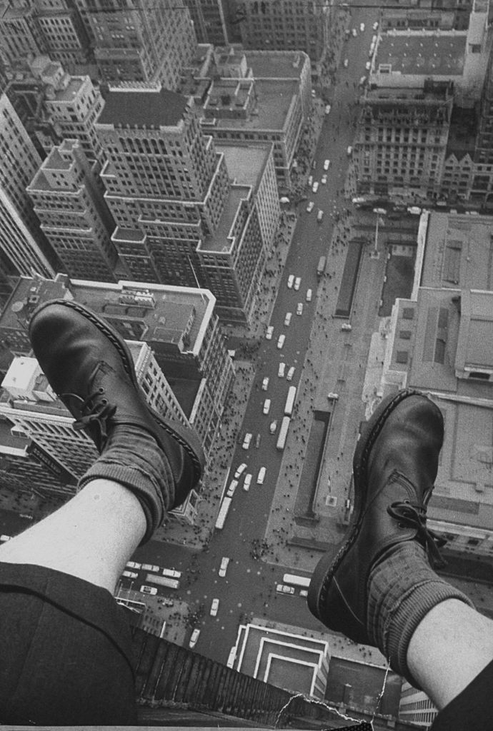 A shot of photograher Grey Villet attempting to cure the fear of heights by getting out on the 58th floor window ledge and photographing his feet hanging over 5th Ave and 42nd street. (Photo by Grey Villet//Time Life Pictures/Getty Images)