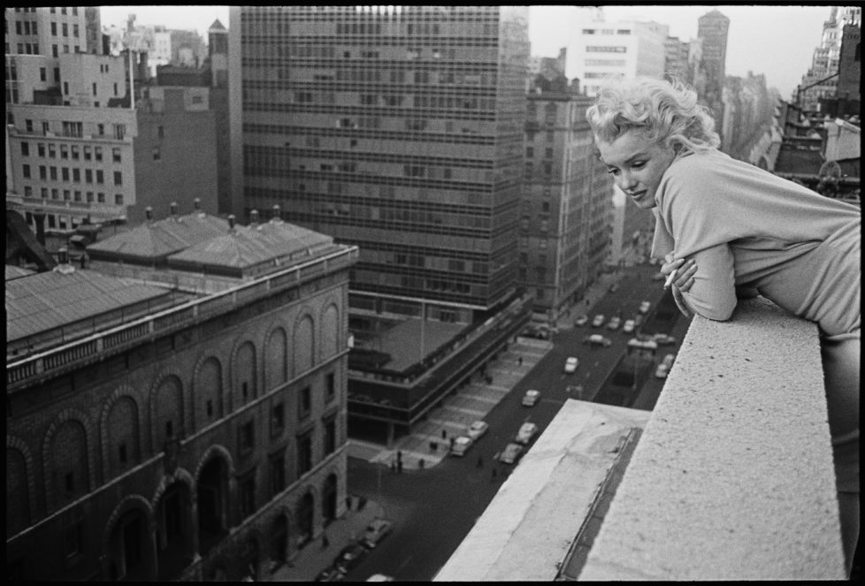 NEW YORK CITY - MARCH 1955: American actress Marilyn Monroe (1926 - 1962) leans over the balcony of the Ambassador Hotel in March 1955 in New York City, New York. (Photo by Ed Feingersh/Michael Ochs Archives/Getty Images)