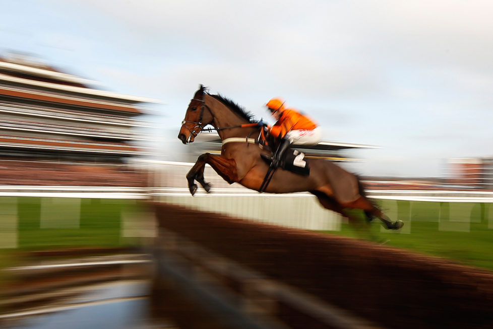 NEWBURY, ENGLAND - NOVEMBER 26: (EDITORS NOTE: Retransmission of #625867610 with alternate crop.) Tom Scudamore riding Thistlecrack clear the water jump before going on to win The bet365 Novices' Steeple Chase at Newbury Racecourse on November 26, 2016 in Newbury, England. (Photo by Alan Crowhurst/Getty Images) *** BESTPIX ***