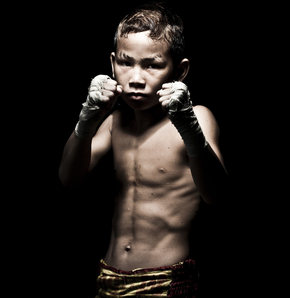 Muay Thai Kickboxing fighter Suwanaked poses at Sangmorakot gymnasium in Bangkok, Thailand. Muay Thai, also know as "Art of Eight Limbs", is a combat martial art and Thailand's national sport. (Photo by Victor Fraile/Corbis via Getty Images)