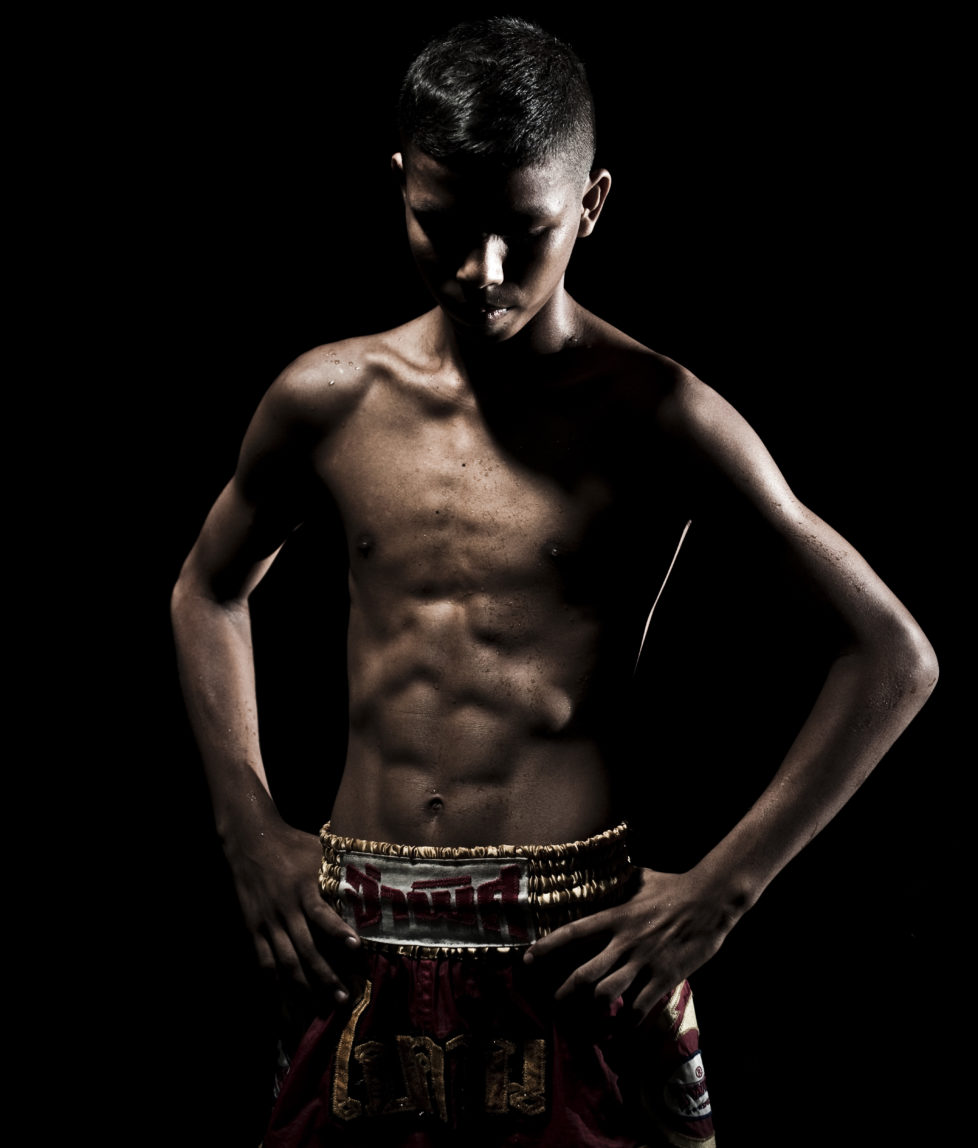 A muay thai Kickboxing fighter from the Rompo Gym poses in Bangkok, Thailand. Muay Thai, also know as "Art of Eight Limbs", is a combat martial art and Thailand's national sport. (Photo by Victor Fraile/Corbis via Getty Images)