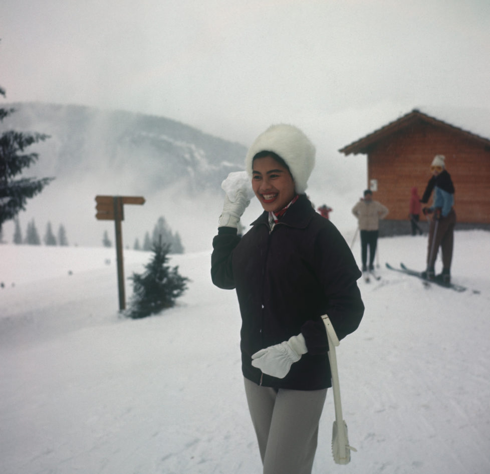 Queen Sirikit of Thailand throwing a snowball while on holiday in Gstaad, Switzerland in 1960. (Photo by Keystone/Getty Images) *** Local Caption *** Sirikit